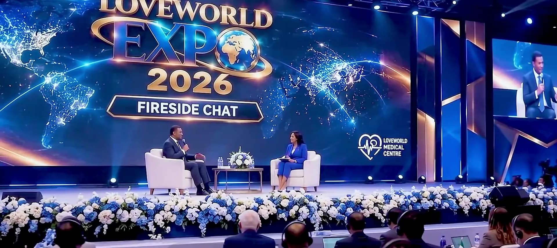 A fireside chat on the LoveWorld Expo stage before a large audience
