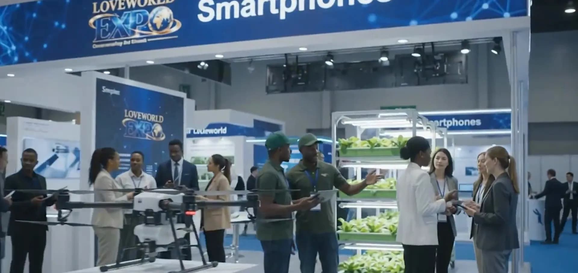 Visitors watching a drone and indoor-farming demo